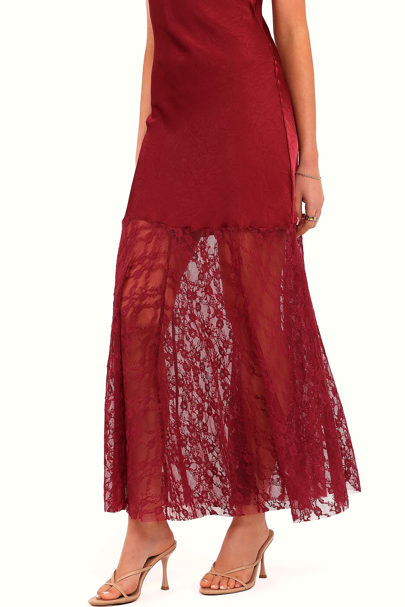 Contrast lace design set against the red satin