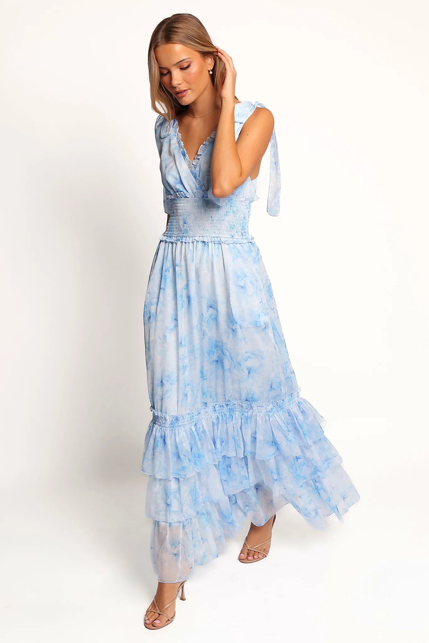 Tiered ruffle hemline of the blue floral dress
