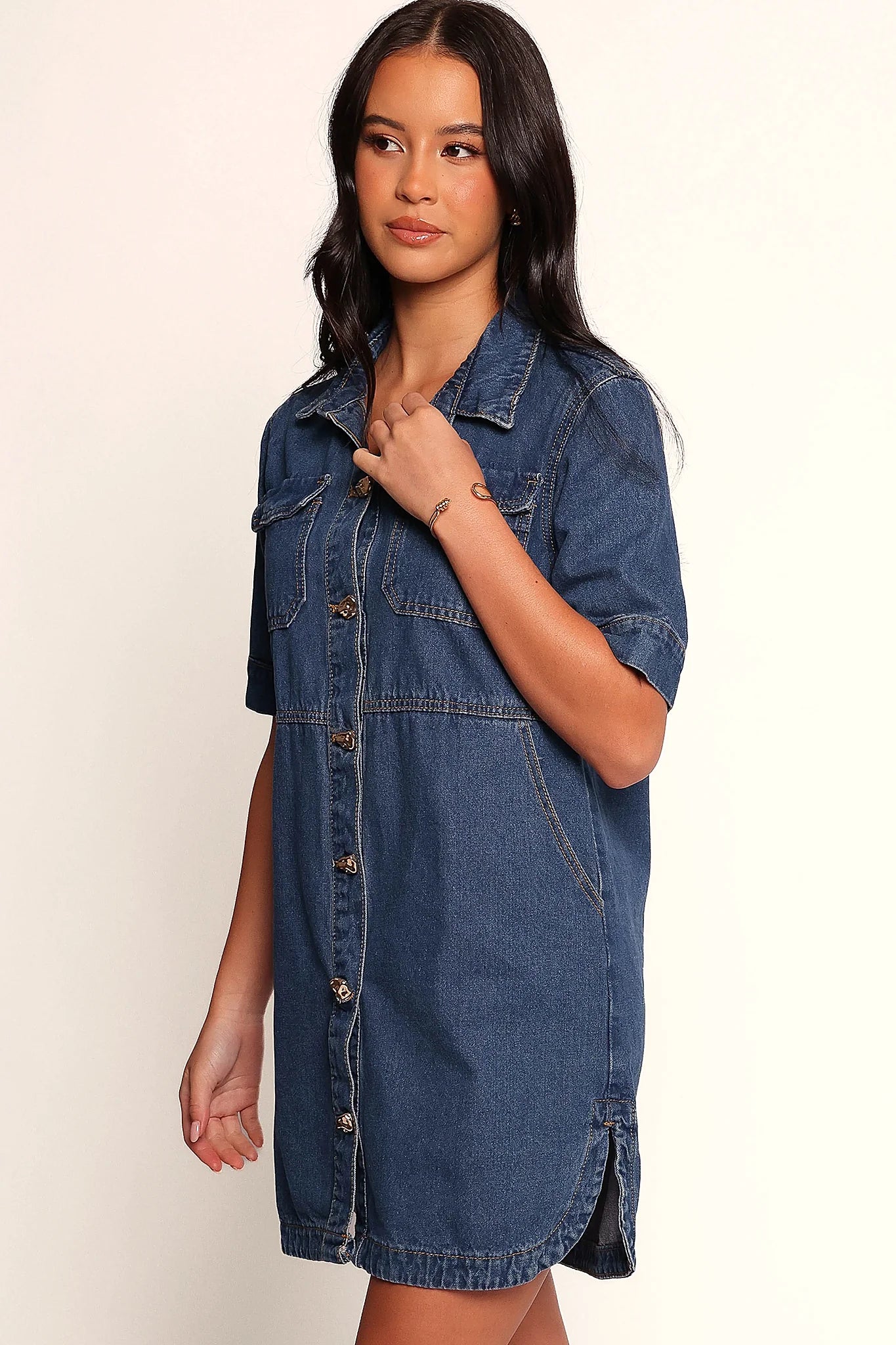 Side split at the hem of the denim mini dress