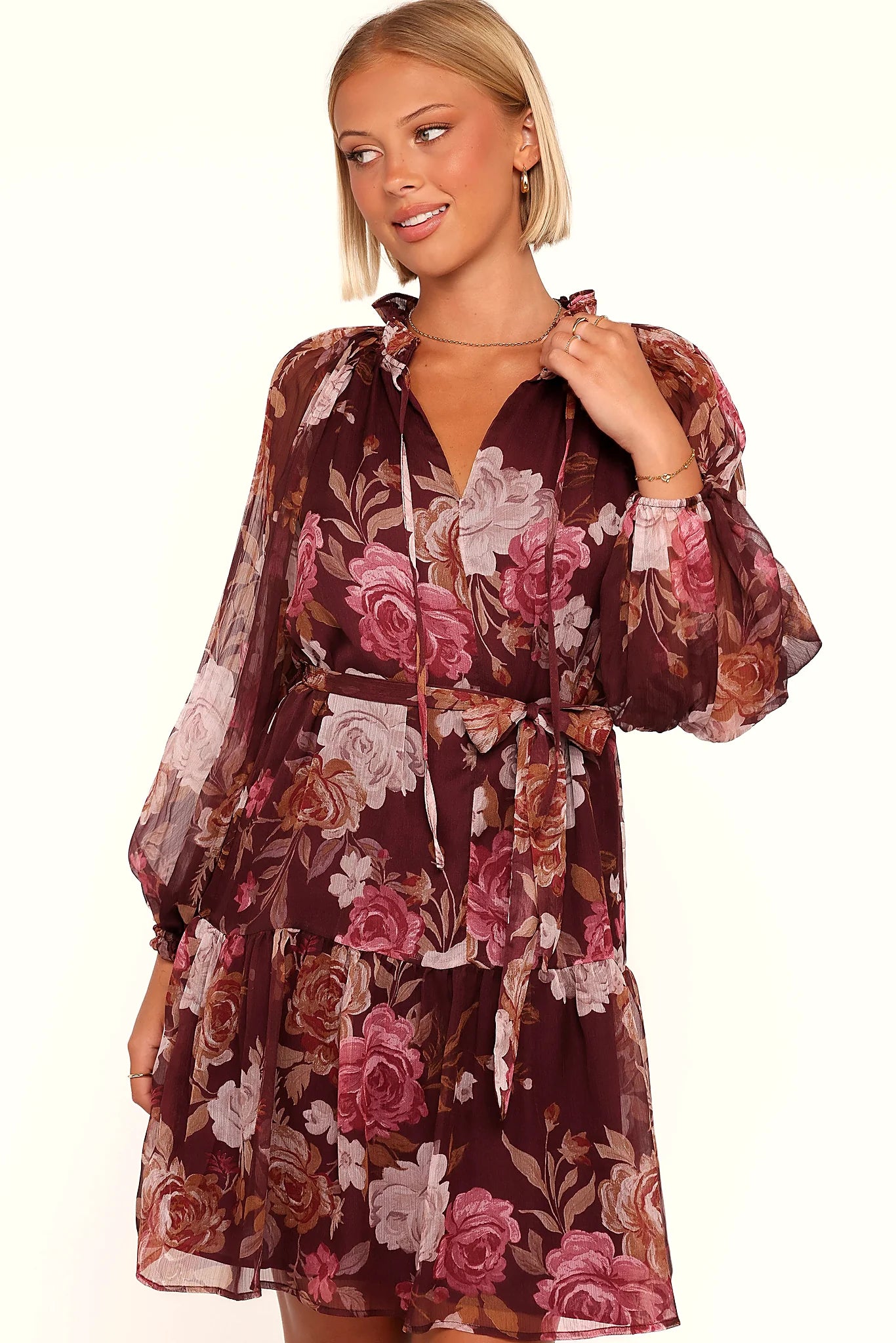V neckline drawn closed with a tie