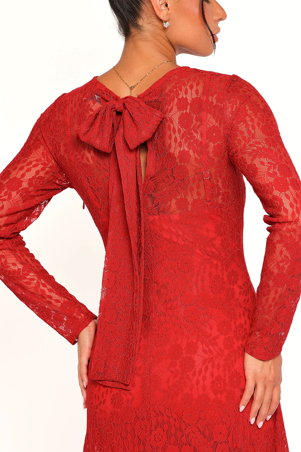 Floral lace overlay across the red maxi