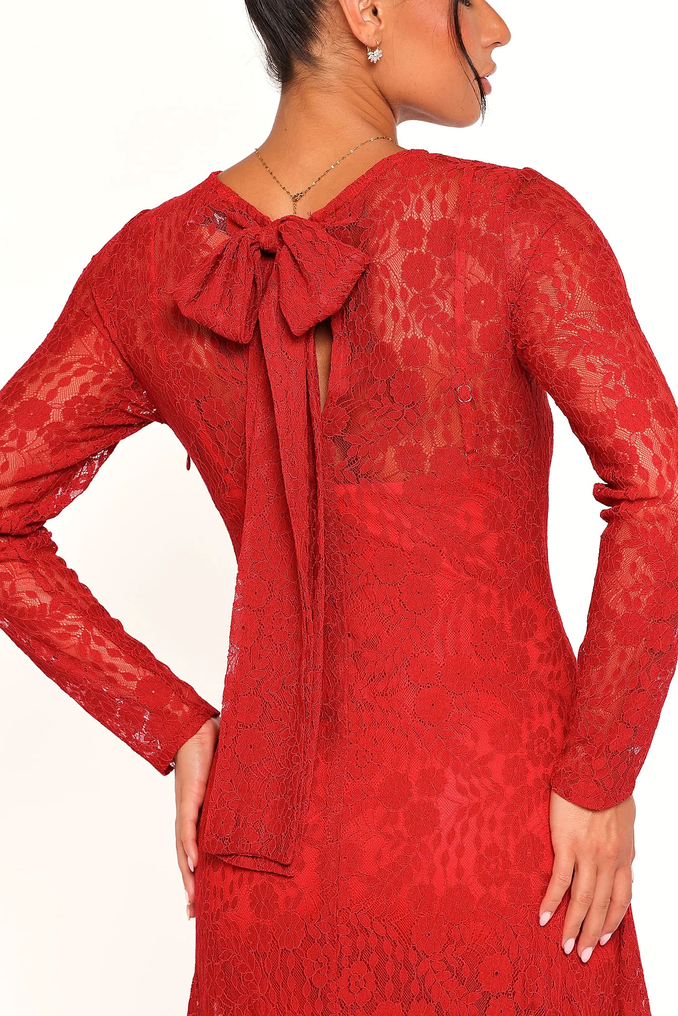 Floral lace overlay across the red maxi