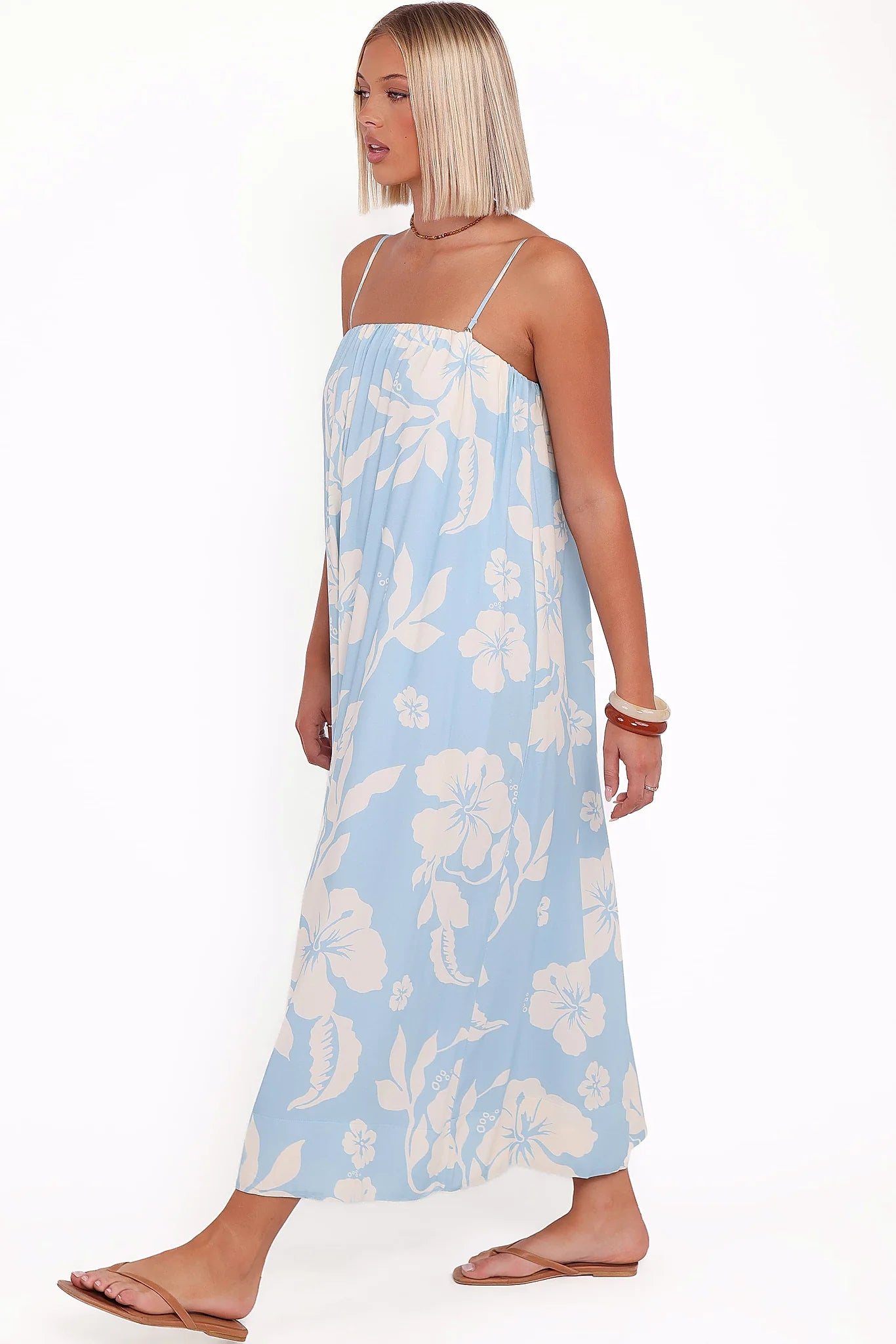 Blue hibiscus shift maxi dress photographed from the front