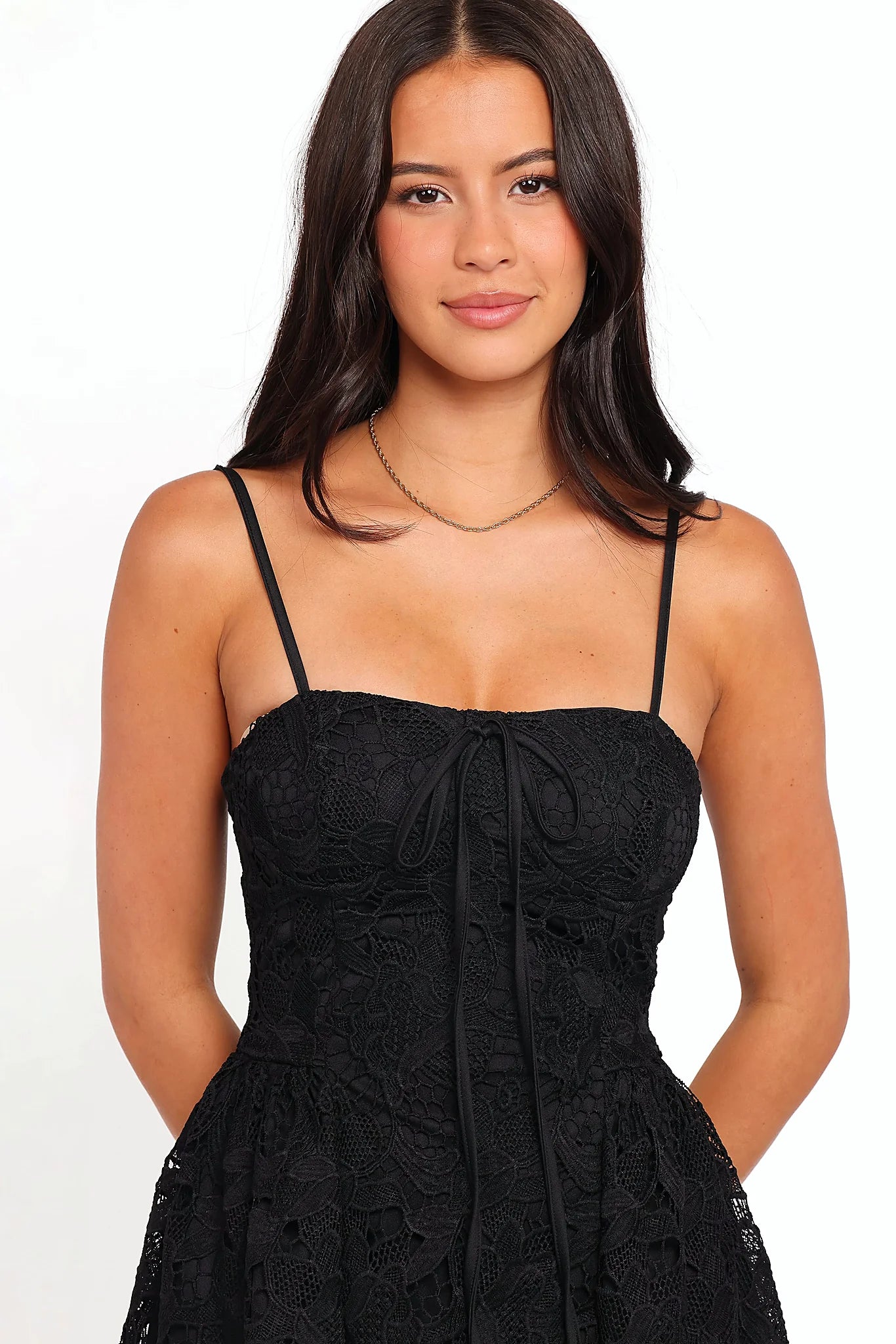 Black floral lace mini dress photographed from the front