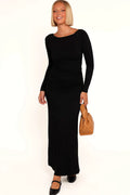 Black boat neck maxi dress photographed from the front