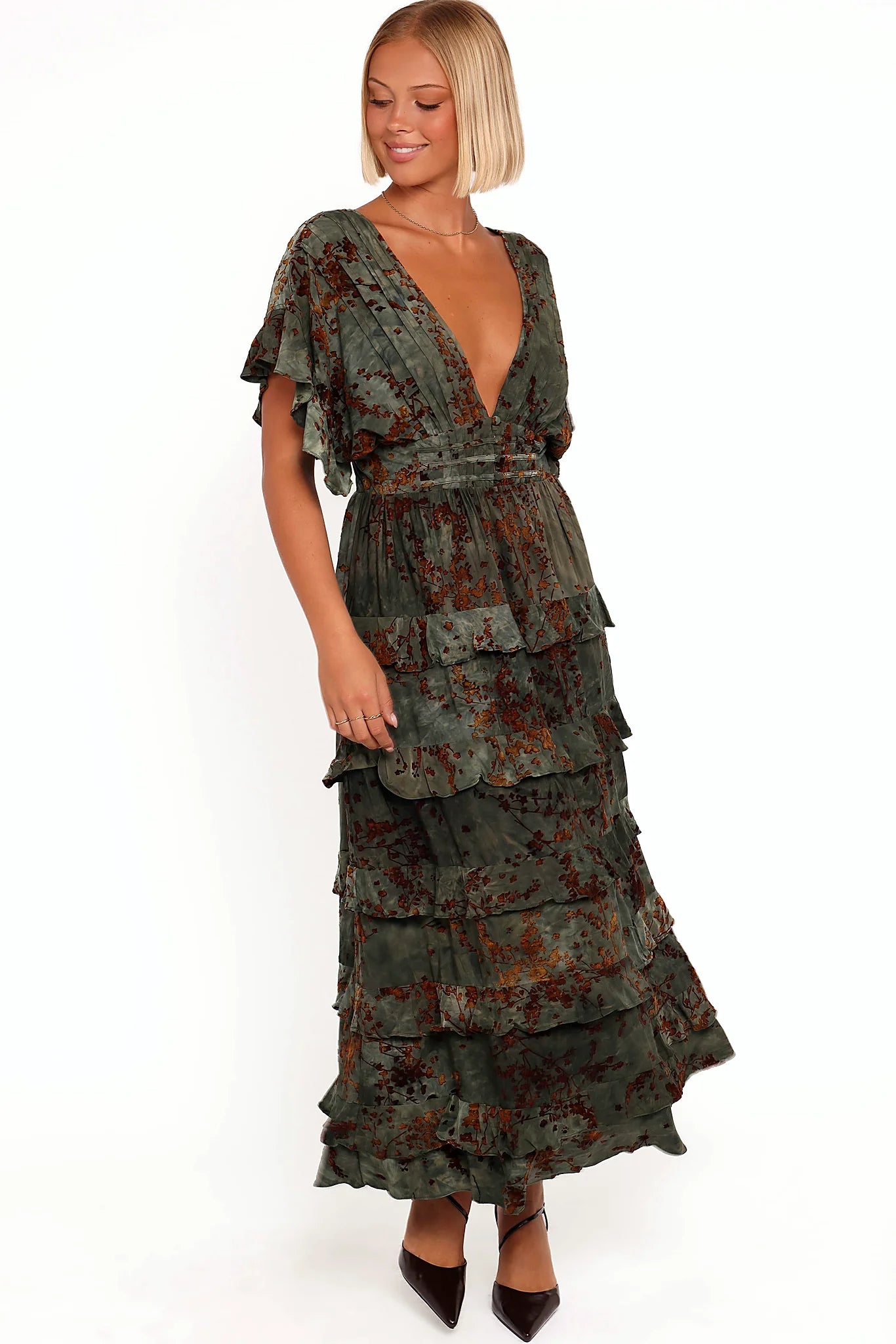 Deep v neckline with buttons across the bust