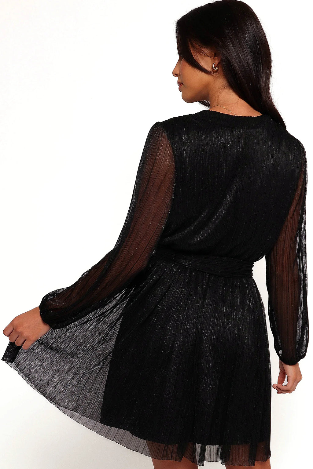 Elasticised cuff at the wrist of the black mini dress